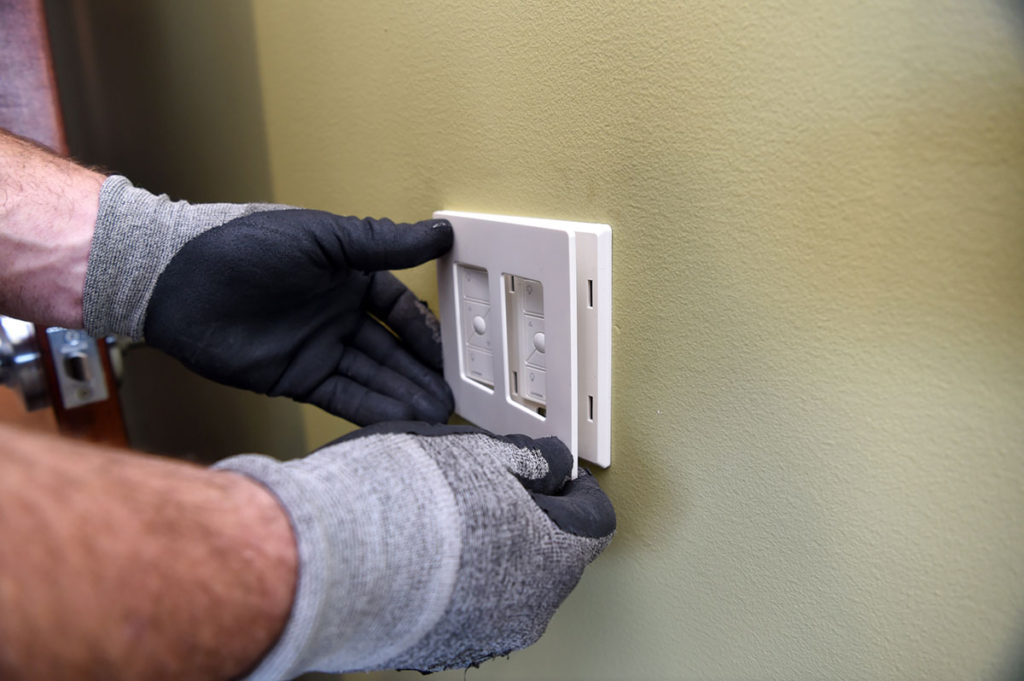 Commercial electrical contractor installing light switch